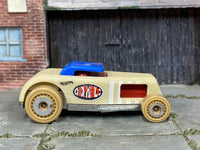 Hot Wheels Chop 'n Bloc tan wood-textured body and blue roof, right side view