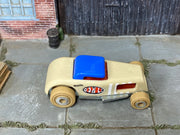 Hot Wheels Chop 'n Bloc tan wood-textured body and blue roof, top view