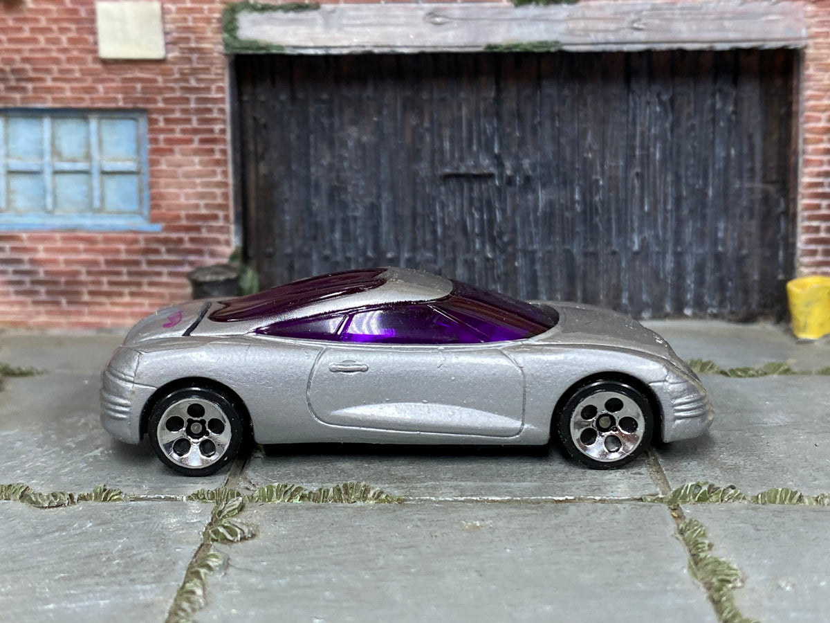 Hot Wheels Chrysler Thunderbolt silver with purple windows loose car, right side view