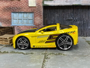 Hot Wheels Corvette C6 Tooned yellow number 5, left-side view