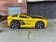 Hot Wheels Corvette C6 Tooned yellow number 5, right-side view