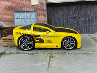 Hot Wheels Corvette C6 Tooned yellow number 5, right-side view