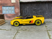 Hot Wheels Corvette C6 Convertible yellow with black and red stripes, left side view