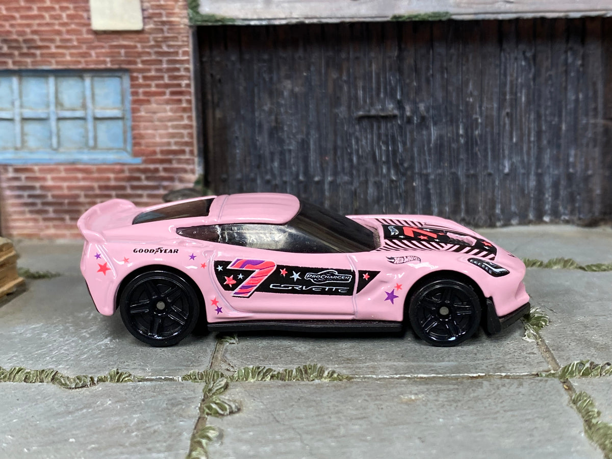 Hot Wheels Corvette C7 Z06 pink number 7 and star graphics, right side view