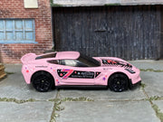 Hot Wheels Corvette C7 Z06 pink number 7 and star graphics, right side view