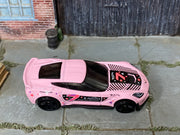 Hot Wheels Corvette C7 Z06 pink number 7 and star graphics, top view