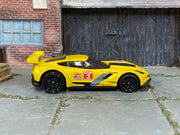 Hot Wheels Corvette C7.R yellow number 3 loose car, right-side view