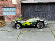 Hot Wheels Corvette Stingray III in silver with colorful flames, left side view