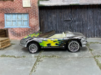 Hot Wheels Corvette Stingray III in silver with colorful flames, left side view