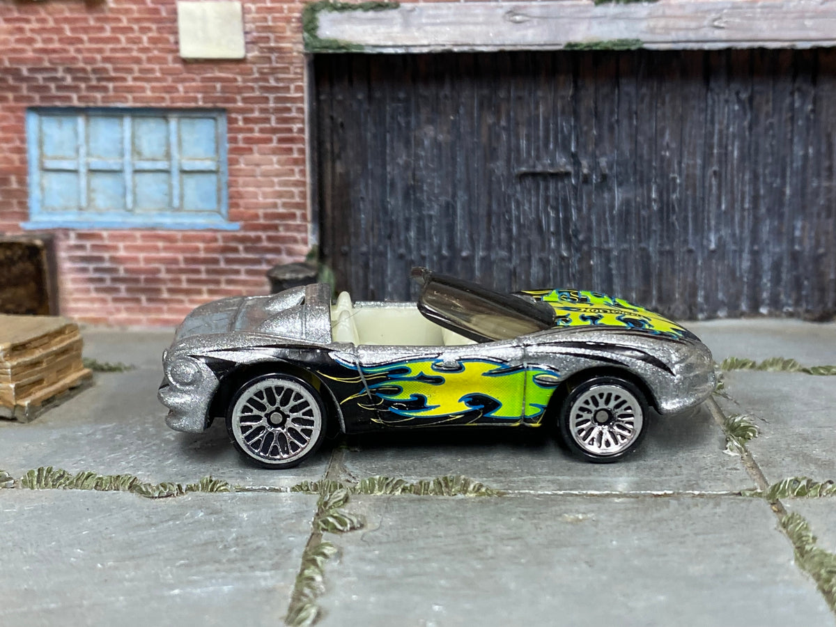 Hot Wheels Corvette Stingray III in silver with colorful flames, right side view