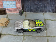 Hot Wheels Corvette Stingray III in silver with colorful flames, top view