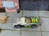 Hot Wheels Corvette Stingray III in silver with colorful flames, top view