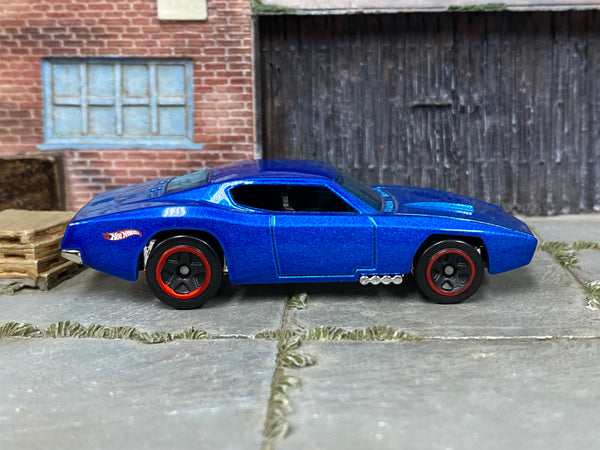 Hot Wheels Custom Otto metallic blue with red-rimmed black wheels, right side view