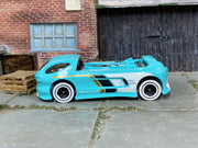 Hot Wheels Deora II turquoise and white loose car, left side view