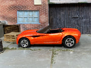 Metallic orange Hot Wheels Dodge Concept Car — left side view