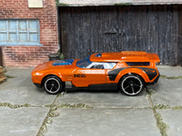 Hot Wheels Drift'n Break metallic orange, left side view with visible play wear