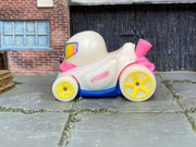 Hot Wheels Duck N' Roll Glow in the Duck pink and blue loose vehicle, left side view