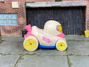 Hot Wheels Duck N' Roll Glow in the Duck pink and blue loose vehicle, right side view