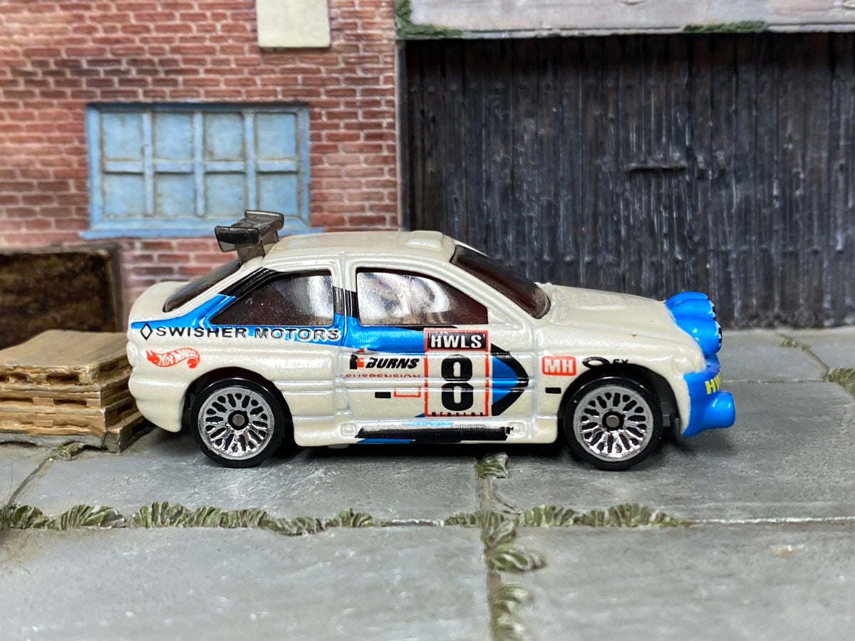 Hot Wheels Escort Rally white and blue number 8 Swisher Motors, right side view