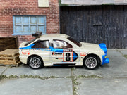 Hot Wheels Escort Rally white and blue number 8 Swisher Motors, right side view