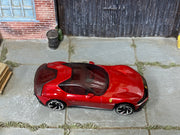 Hot Wheels Ferrari 12Cilindri metallic red with black roof, top view
