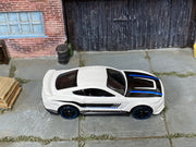 Hot Wheels Ford Shelby GT350R white with black and blue stripes, top view