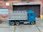 Hot Wheels Ford Stake Bed Truck teal cab and gray bed, right side view
