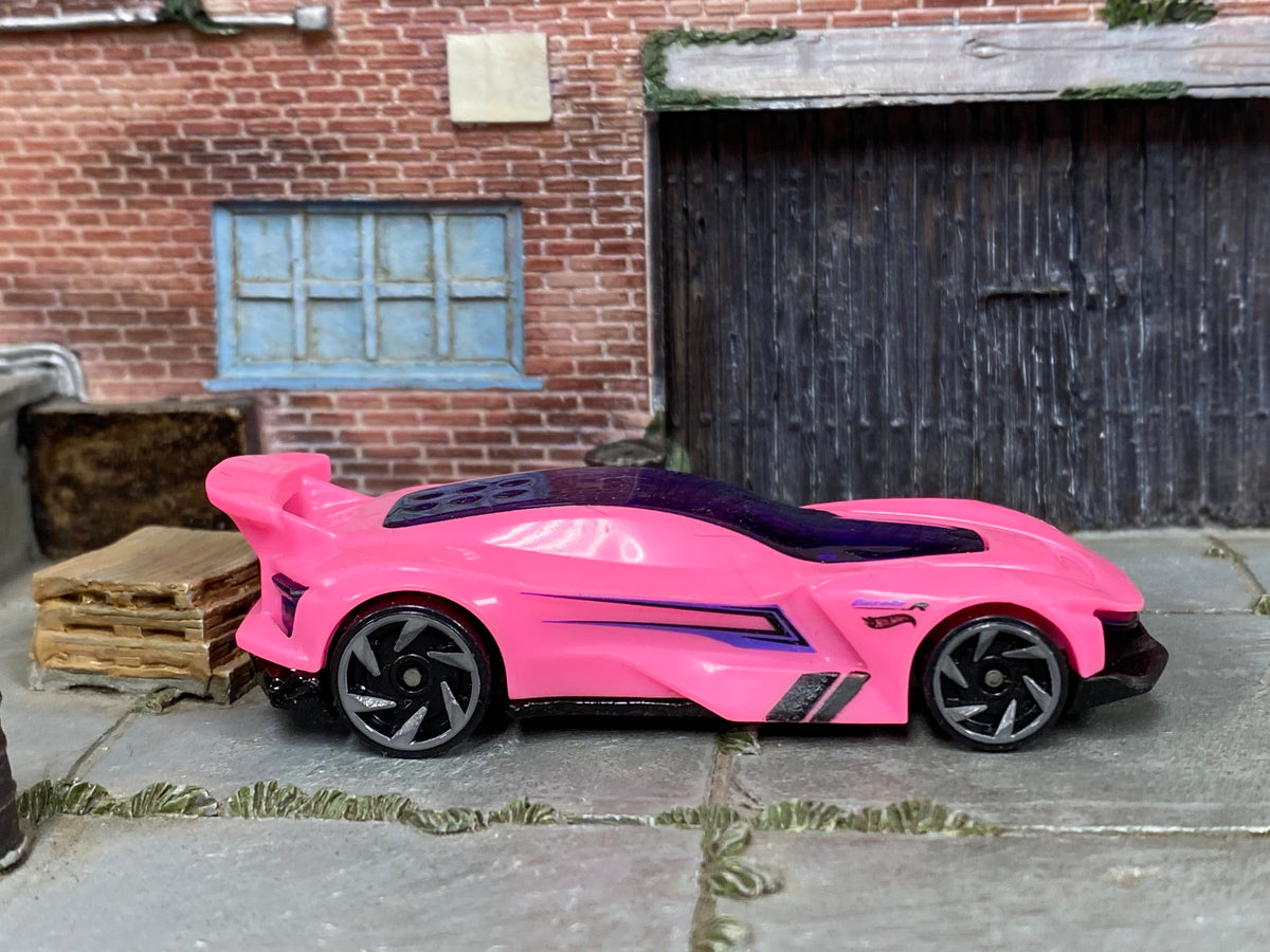 Hot Wheels Gazella R in pink and purple, right-side view of loose car