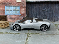 Silver Hot Wheels Gordon Murray Automotive T.33, left-side view of loose car