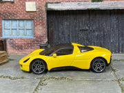 Yellow Hot Wheels Gordon Murray Automotive T.33 loose car, left side view