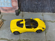 Yellow Hot Wheels Gordon Murray Automotive T.33 loose car, top view