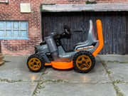 Hot Wheels Grass Chomper silver and orange Mow Patrol loose vehicle, left side view