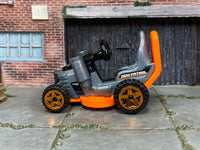 Hot Wheels Grass Chomper silver and orange Mow Patrol loose vehicle, left side view