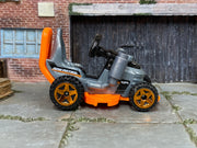 Hot Wheels Grass Chomper silver and orange Mow Patrol loose vehicle, right side view