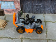 Hot Wheels Grass Chomper silver and orange Mow Patrol loose vehicle, top view
