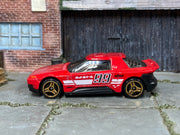 Red number 99 Hot Wheels Hako Type D loose car, left side view