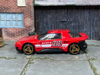 Red number 99 Hot Wheels Hako Type D loose car, left side view