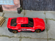 Red number 99 Hot Wheels Hako Type D loose car, top view