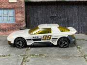 Hot Wheels Hako Type D pearl white number 99 with yellow windows, left side view