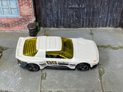 Hot Wheels Hako Type D pearl white number 99 with yellow windows, top view