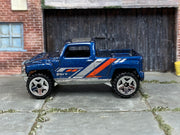 Hot Wheels Hummer H3T Concept metallic blue loose truck, left-side view