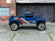 Hot Wheels Hummer H3T Concept metallic blue loose truck, right-side view