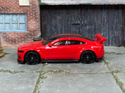 Hot Wheels Jaguar XE SV Project 8 red — left-side view