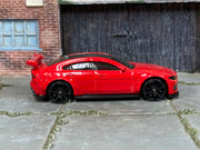Hot Wheels Jaguar XE SV Project 8 red — right-side view