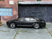 Metallic black Hot Wheels Lexus SC400 loose car, left side view