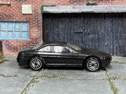 Metallic black Hot Wheels Lexus SC400 loose car, right side view