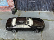 Metallic black Hot Wheels Lexus SC400 loose car, top view