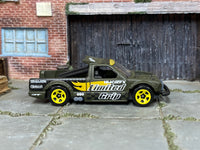 Hot Wheels Limited Grip olive and yellow loose truck, right side view