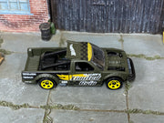 Hot Wheels Limited Grip olive and yellow loose truck, top view