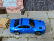 Hot Wheels Maserati Shamal metallic blue with black roof trim, top view